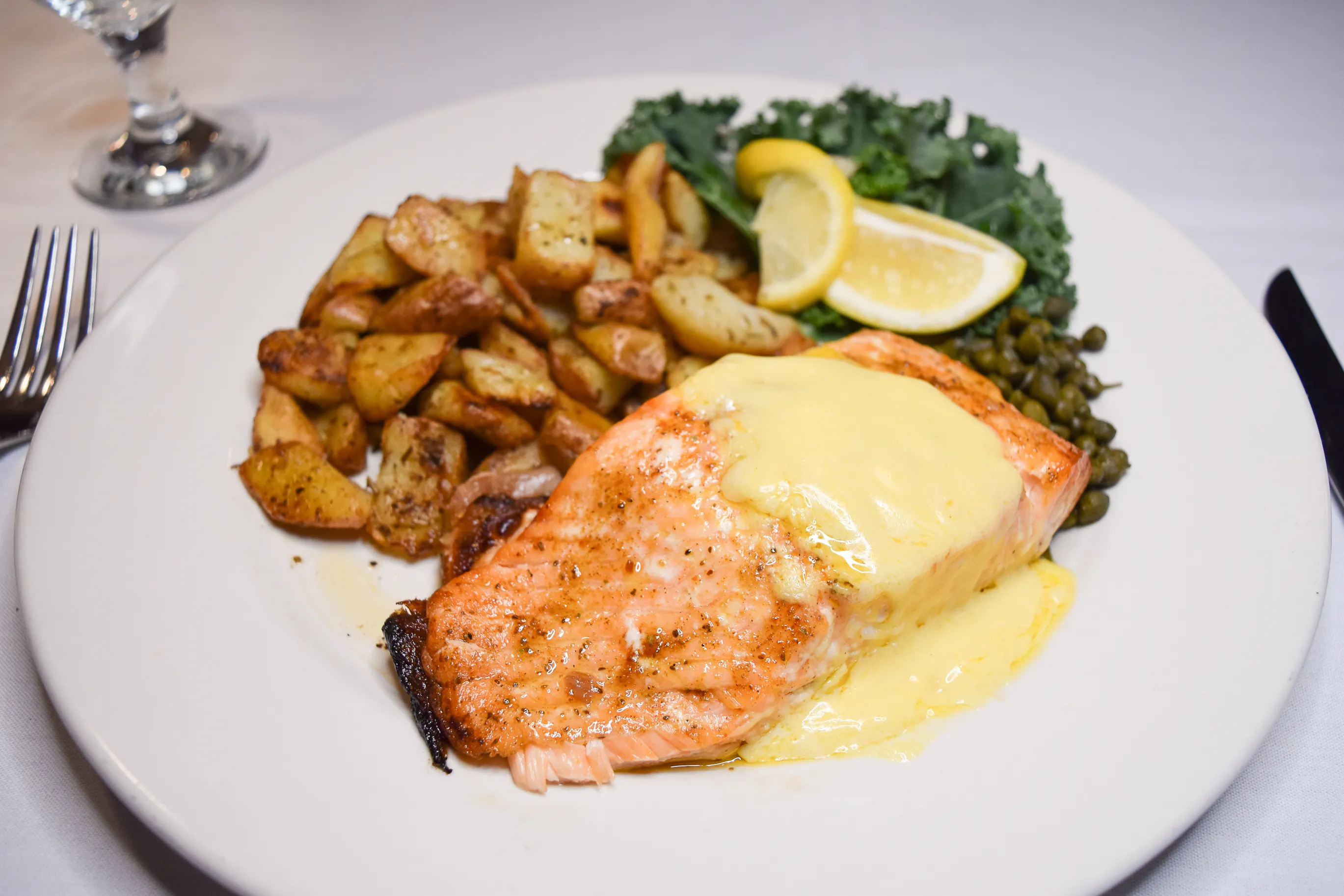 A plated salmon dinner photographed for The Cotton Loft catering service